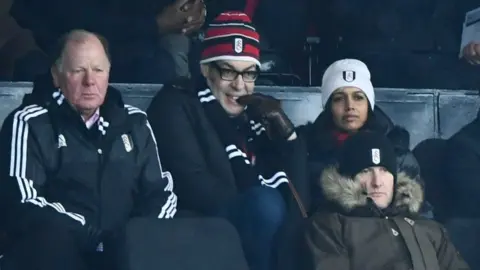 Shutterstock Richard Osman watching Fulham FC