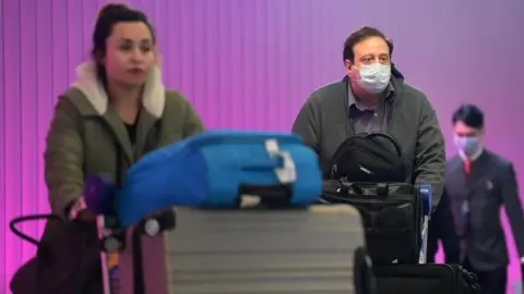 AFP Travellers amid coronavirus concerns