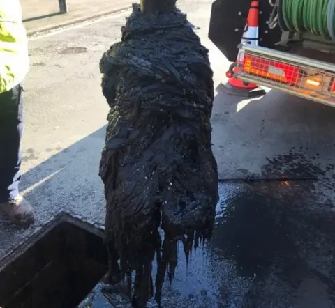 Yorkshire Water A mass of wet wipes being removed from a sewer