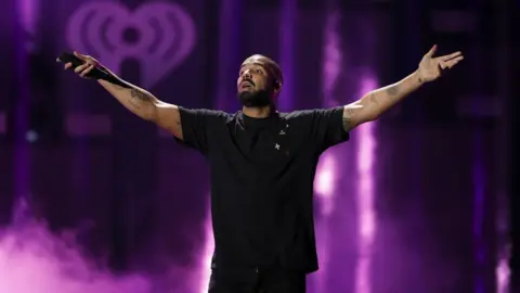 Getty Images Rapper Drake performs onstage at the 2016 iHeartRadio Music Festival at T-Mobile Arena on September 23, 2016 in Las Vegas, Nevada.