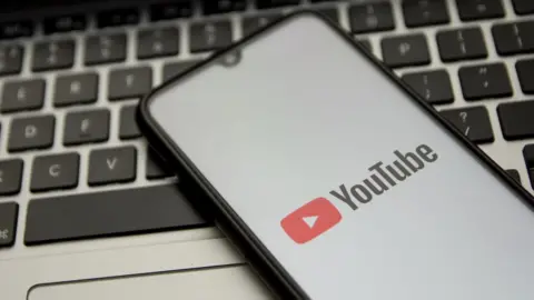 Getty Images Phone with a YouTube logo
