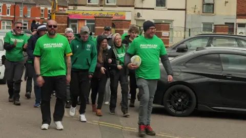 Stephen Huntley/BBC Group of walkers arrives at Franklin's Gardens
