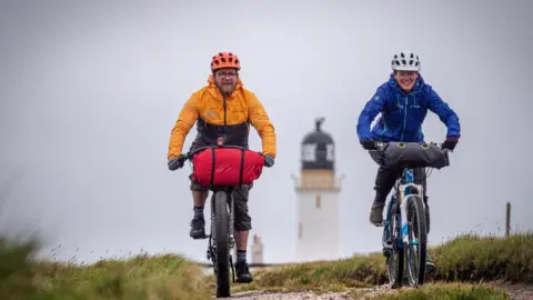 Cycling UK Two cyclists at Cape Wrath