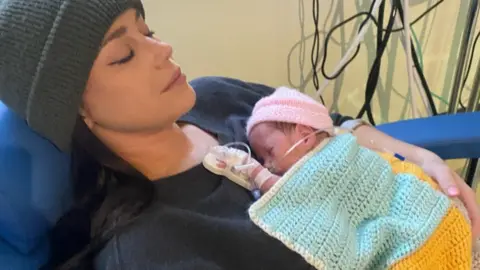 Lottie Mears Lottie Mears and her newborn daughter Celine