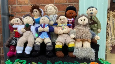 Ghosts characters knitted onto postbox topper in Syston