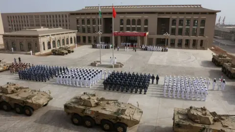 AFP File photo from 1 August 2017 shows Chinese People's Liberation Army personnel attending the opening ceremony of China's new military base in Djibouti