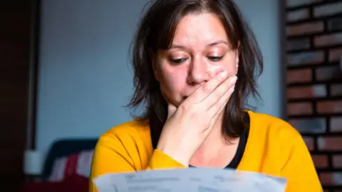 Woman worried about bills