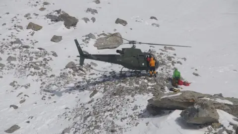 AFP Members of the Polish K2 expedition rescue French climber Elisabeth Revol in Nanga Parbat