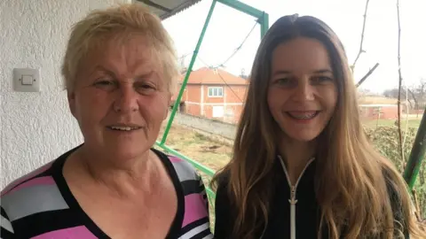 Xhevahire Shabani (L) and her daughter in Trnovac