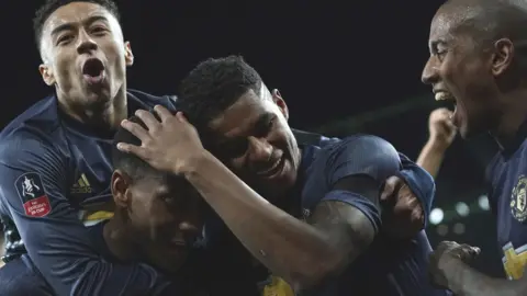 Manchester United players celebrate