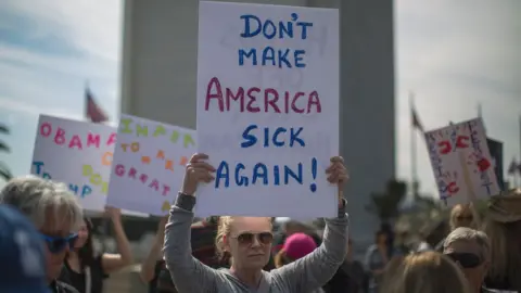 Getty Images Demonstrators protest Donald Trump's policies that threaten the Affordable Care Act, Medicare and Medicaid, in Los Angeles, California, 25 January 2017