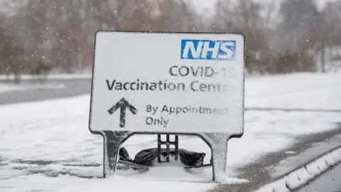 PA Media Covid vaccination centre sign