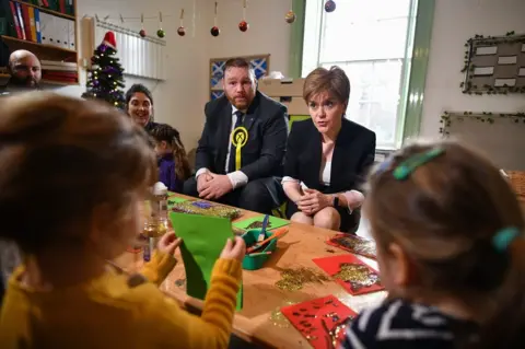 Getty Images Owen Thompson with Nicola Sturgeon