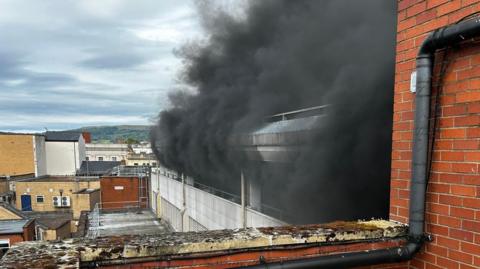 Black smoke coming from the multi-storey car park