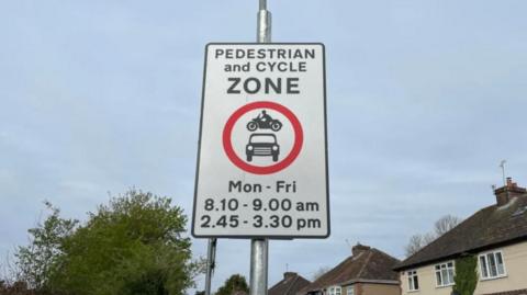 Pedestrian and cycle zone road sign