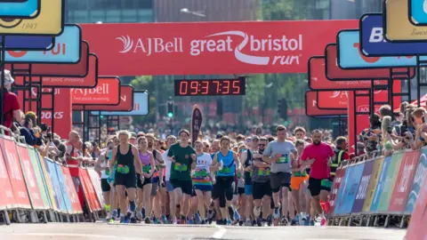 The AJ Bell Great Bristol Run A group of runners starting the Bristol Half Marathon 2024