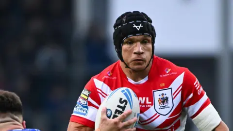 Jonny Lomax in action for St Helens against Warrington Wolves
