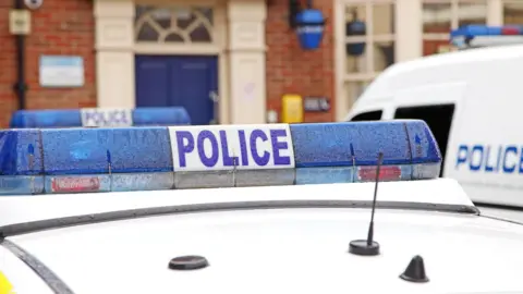 A stock image of a police car.