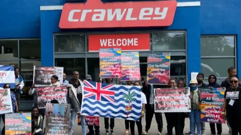 BBC/George Carden Chagos Islanders outside K2 Crawley