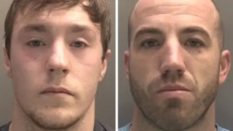 Merseyside Police Daniel Wilson is wearing a dark-coloured T-shirt and has short brown hair in this police photo. Christopher Carney is balding with closely-shaven hair and stubble. He is wearing a grey T-shirt in this police photo.