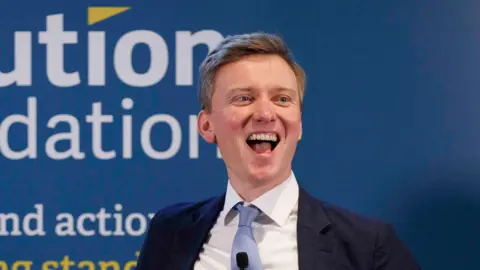 Getty Images Torsten Bell laughing at a Resolution Foundation event