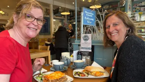 Andrew Turner/BBC Venetta Griffith and Sharon Moon with their lunch at the Bridgestones Cafe