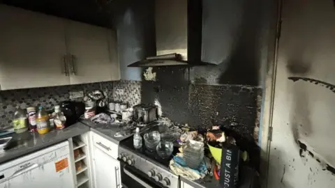 Essex Fire and Rescue Service Smoke and fire damage to a kitchen.