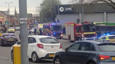 Aaron Cahill Image shows fire engines outside the JD Gym in Bury. A number of engines can be seen, as well as police vehicles. 