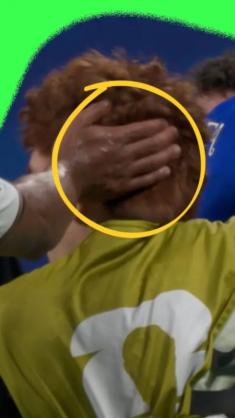 Jude Bellingham smacking the back of the head of an Argentina player after the World Cup semi-final
