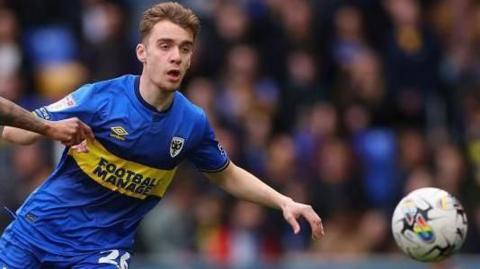Jack Currie in action for AFC Wimbledon