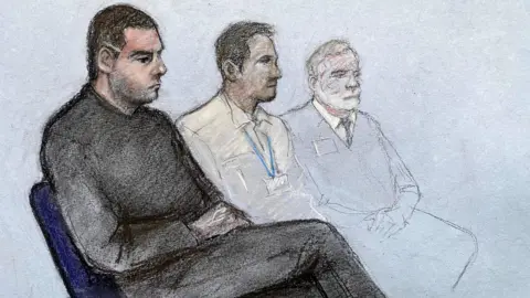 Court artist sketch by Elizabeth Cook of Deividas Skebas (left) appearing at Lincoln Crown Court. There are two court officials sitting next to him. 