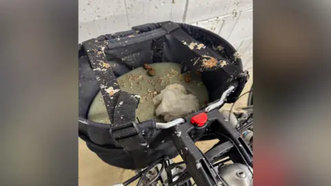 A picture of a bike with raw sewage covering it. 