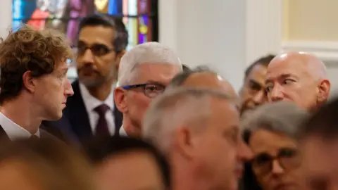 Getty Images Mark Zuckerberg, Tim Cook and Jeff Bezos sit in an audience