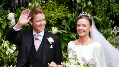 Duke and Duchess wave and smile after their wedding