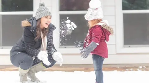 Taylor Golden Taylor Golden - seen here in a snowball fight with her niece - says she's been "lucky" to get the lights back on