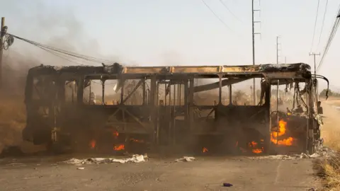 Reuters A bus used as a roadblock by organized crime burns following a federal operation in which a government source said Mexican drug lord Nemesio Oseguera, commonly known as 