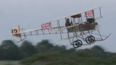 Plane in the sky.