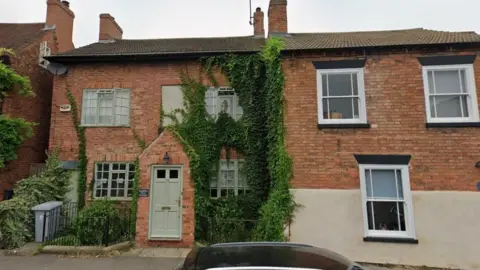 Google Streetview image of two characterful, red brick heritage houses