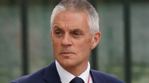 PA Media A picture of Tim Davie in a dark suit