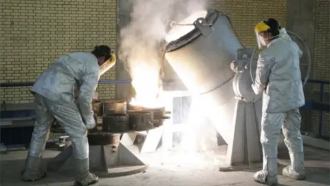 Getty Images Workers at a uranium conversion facility outside Isfahan (file photo)