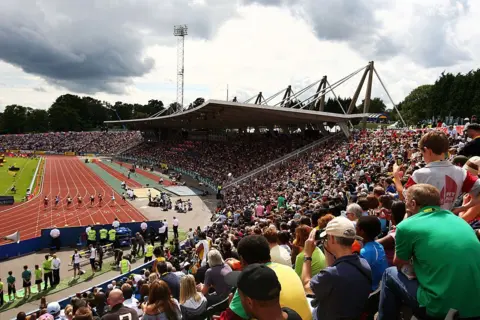 Getty Images A general view of the action during day two of the Aviva London Grand Prix track and field meeting at Crystal Palace Stadium in 2009 - crowds fill the stadium, close to the track.
