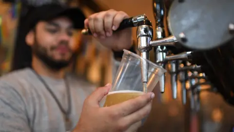 Getty Images Stock image of a man pulling a pint