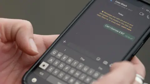 A message being typed in to WhatsApp which reads 'can i borrow £1k?'