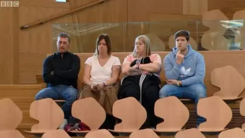 The Orr family watching the debate in the Scottish Parliament