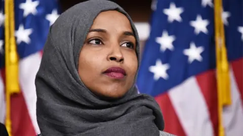 Getty Images Congresswoman Ilhan Omar in front of US flag (file photo)