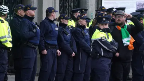 PA Gardaí stand in a line outside Leinster House