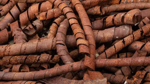 Getty Images File image of rusty copper coils from a mine
