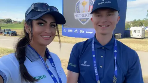 Anna Nilsson Anna with a golfer at the Ryder Cup in Italy in 2023.