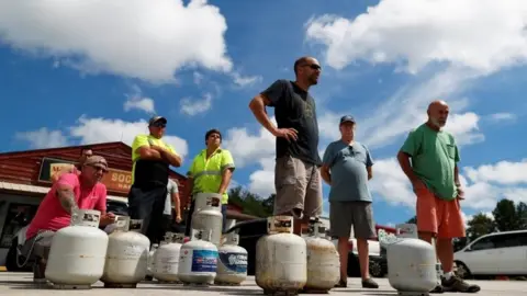 Reuters Customers line up to buy propane at Socastee Hardware store, ahead of the arrival of Hurricane Florence in Myrtle Beach, South Carolina