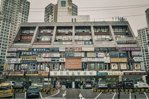 BBC/ Hosu Lee A building filled with after-school classes known as hagwons, which operate from 5am to 10pm